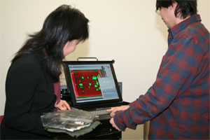 Paul Blair and student demonstrating the device