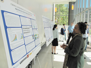 Deborah Jackson, ERC Program Director, looks at CIAN students' posters