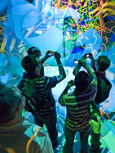 Students from Florida visited Calit2's StarCave virtual reality display as part of FIU's recent Global Cyberbridges workshop.