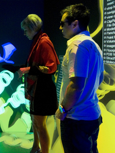 Members of CineGrid explore Calit2's 3-D StarCAVE display.