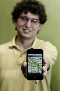 Sam Fernald with iPhone running the Calit2 app