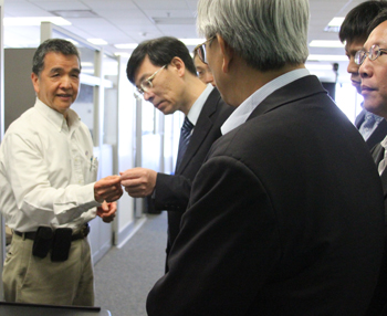 Paul Blair and student demonstrating the device