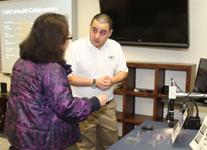 Paul Blair and student demonstrating the device