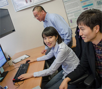 Andrew Kahng (far back) with grad students Hyein Lee (center) and Seokhyeong Kang
