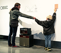 Gallery-goers interact with Michael Trigilio