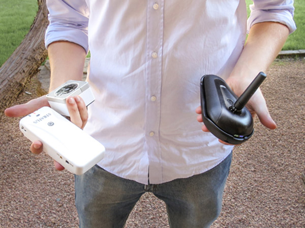 Computer science Ph.D. student Devin Lundberg holds the three devices
