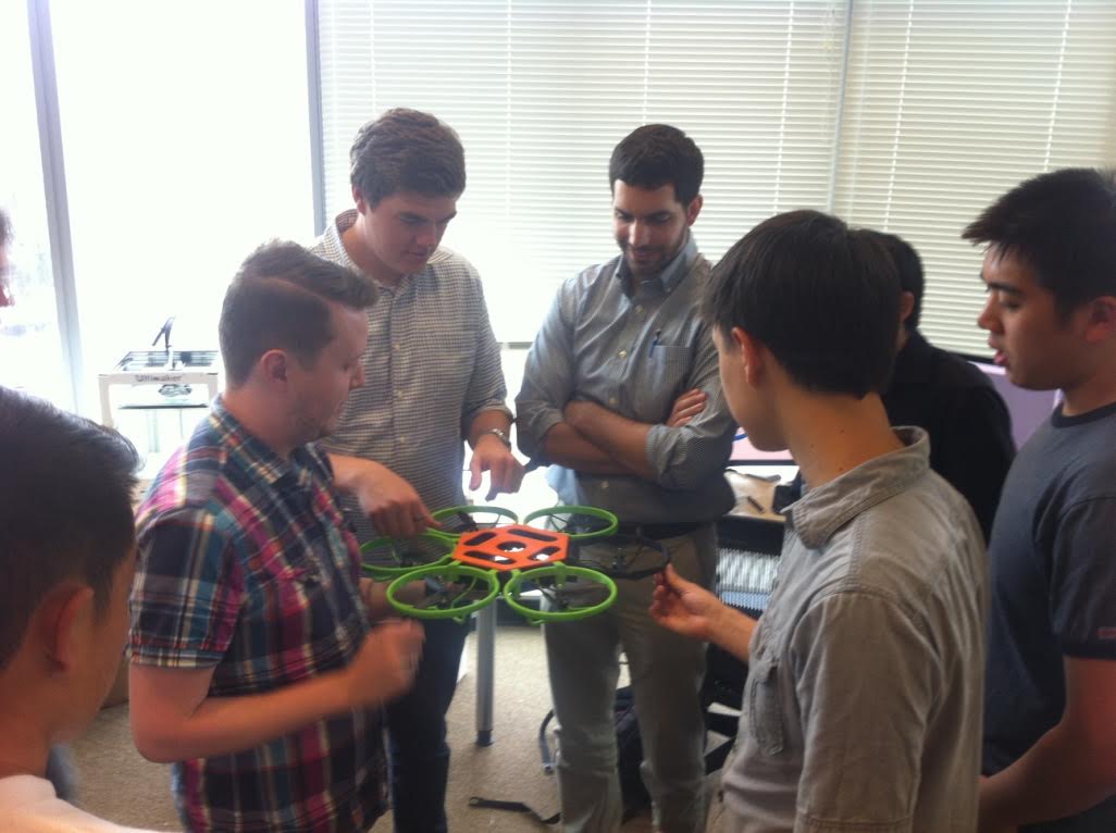 Students holding printed drone