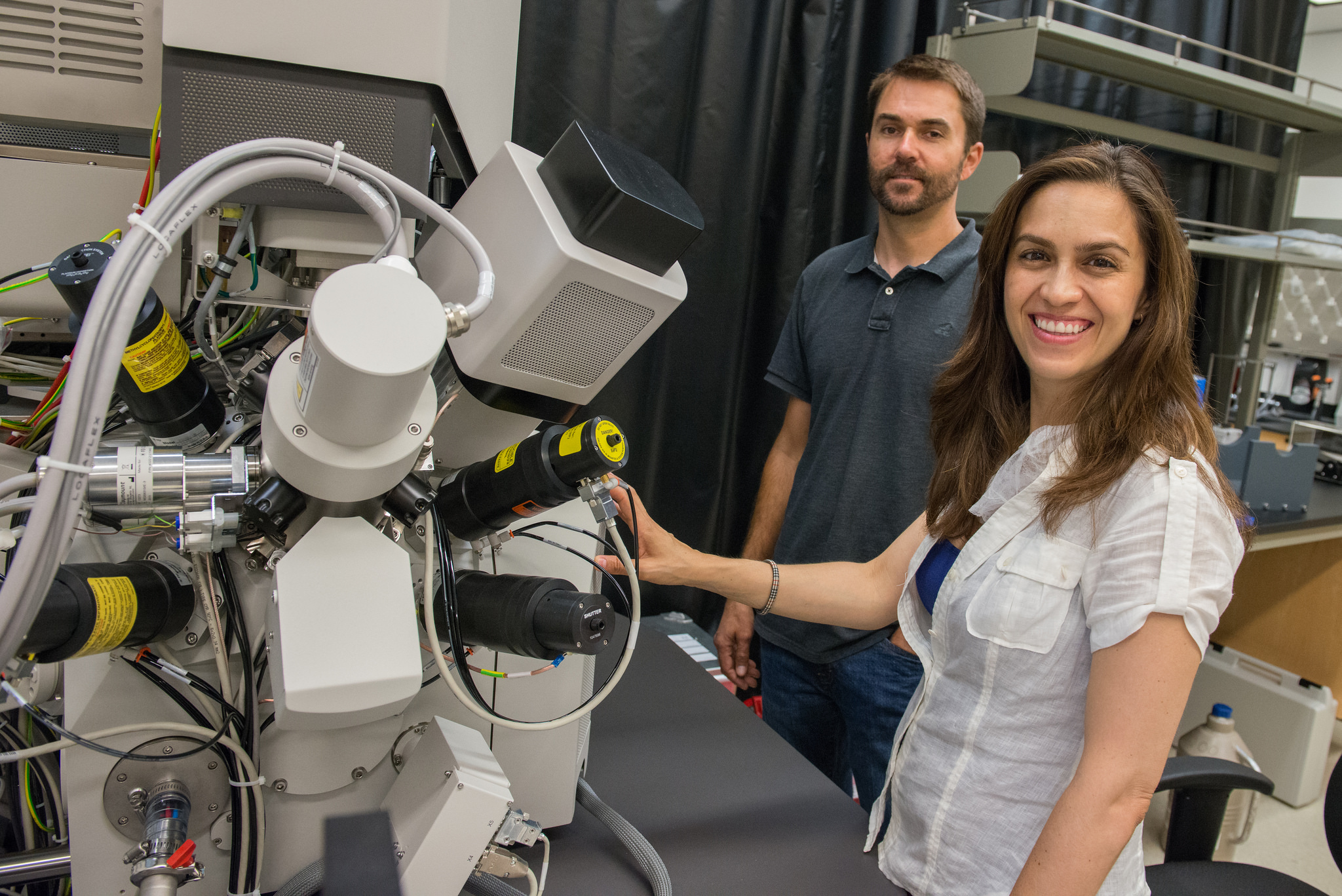 Nano3 Process Engineer Ryan Anderson and Assistant Professor of Biology Elizabeth Villa with the Scios microscrope