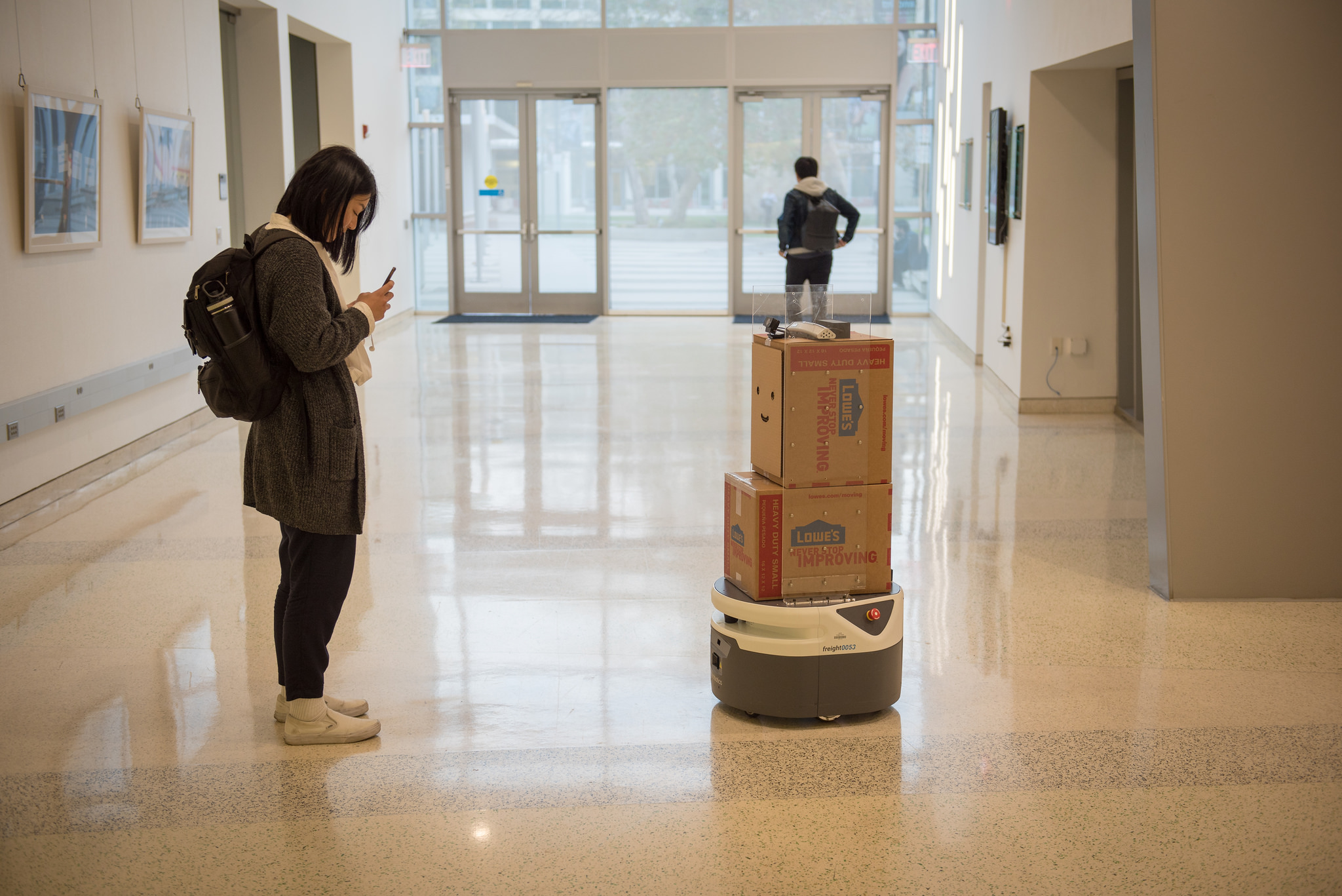 A student interacts with BoxBot