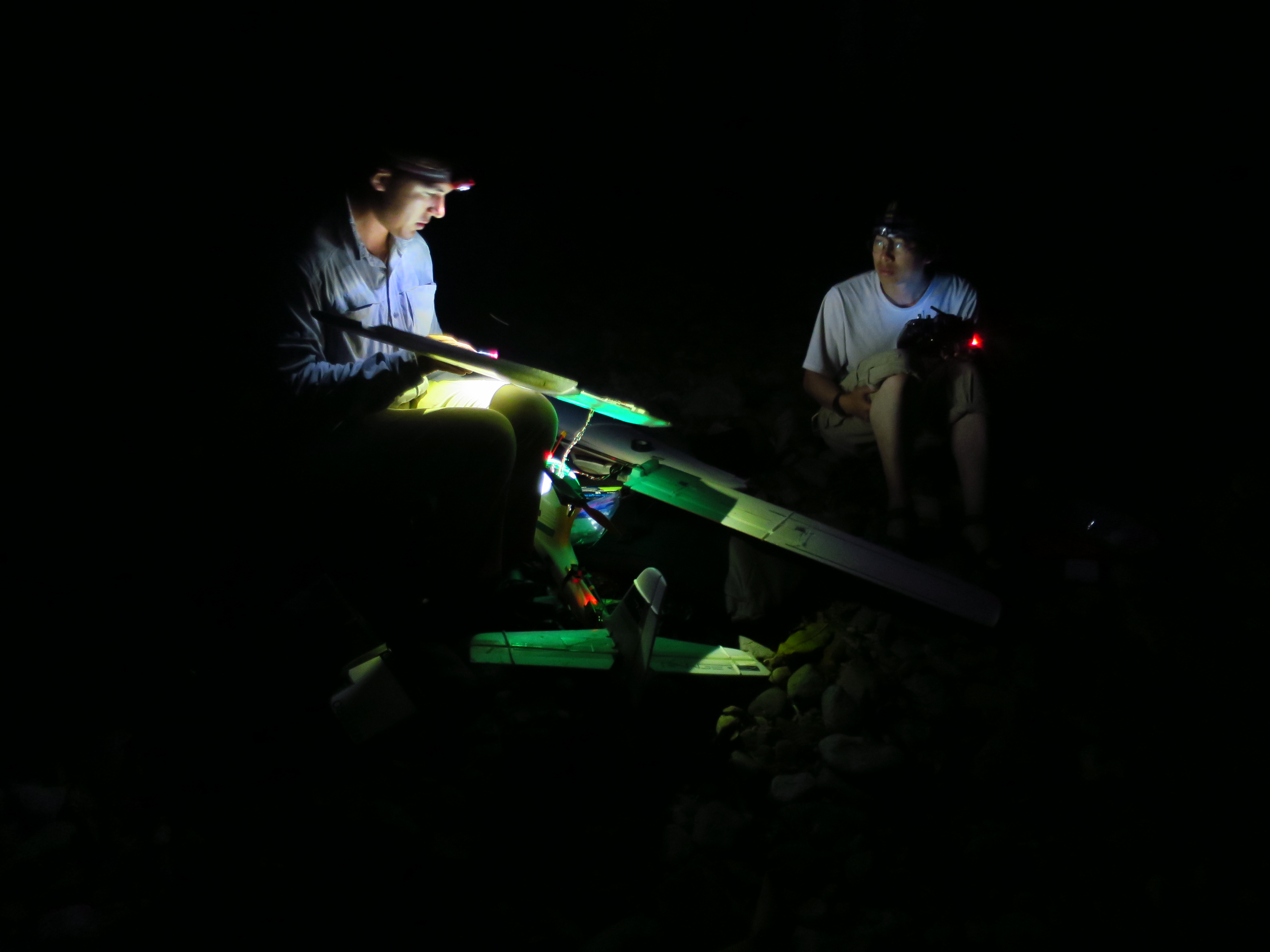 Afshari and Lo making repairs in the jungle