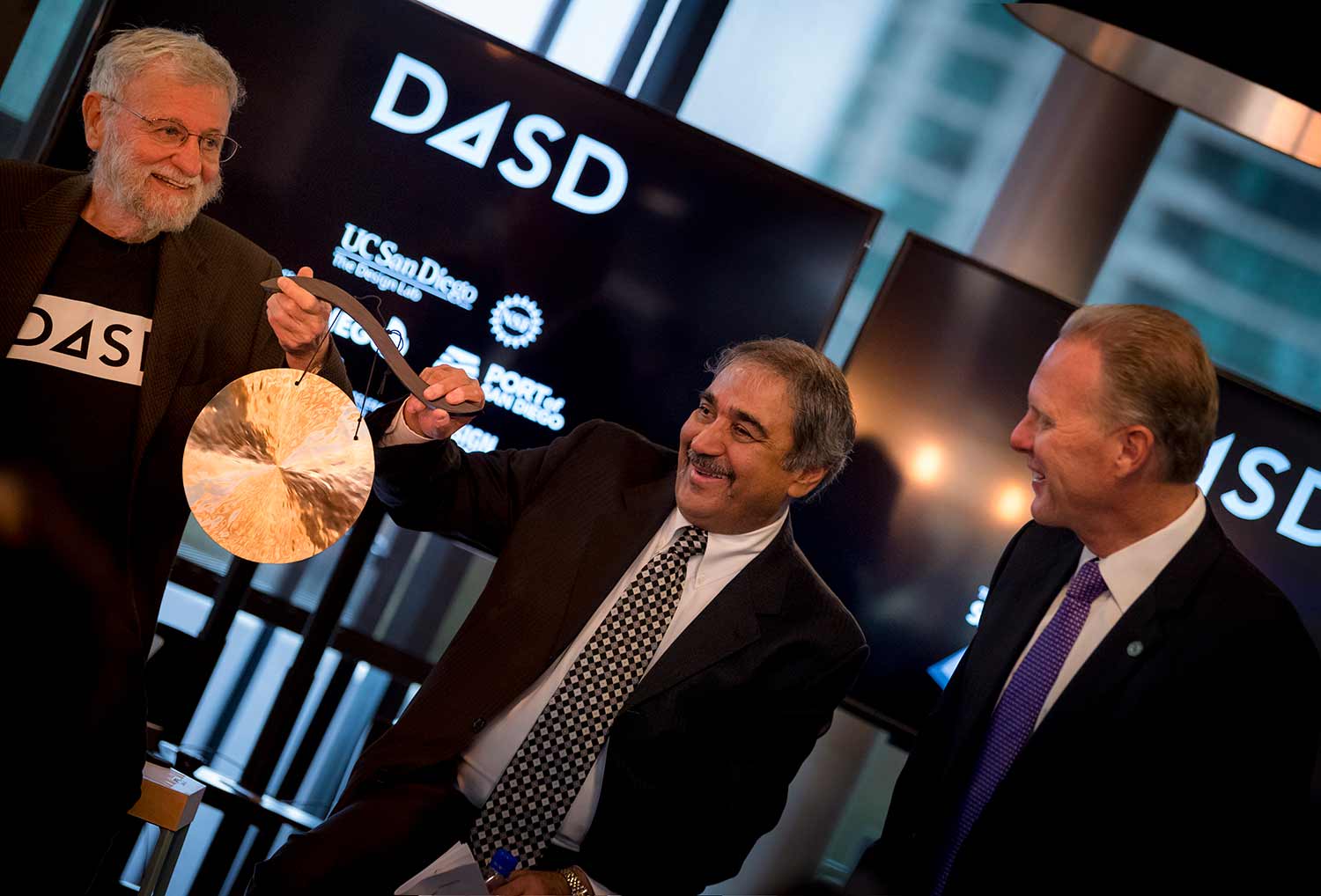 Norman, Khosla, Faulconer banging a gong to start hackathon