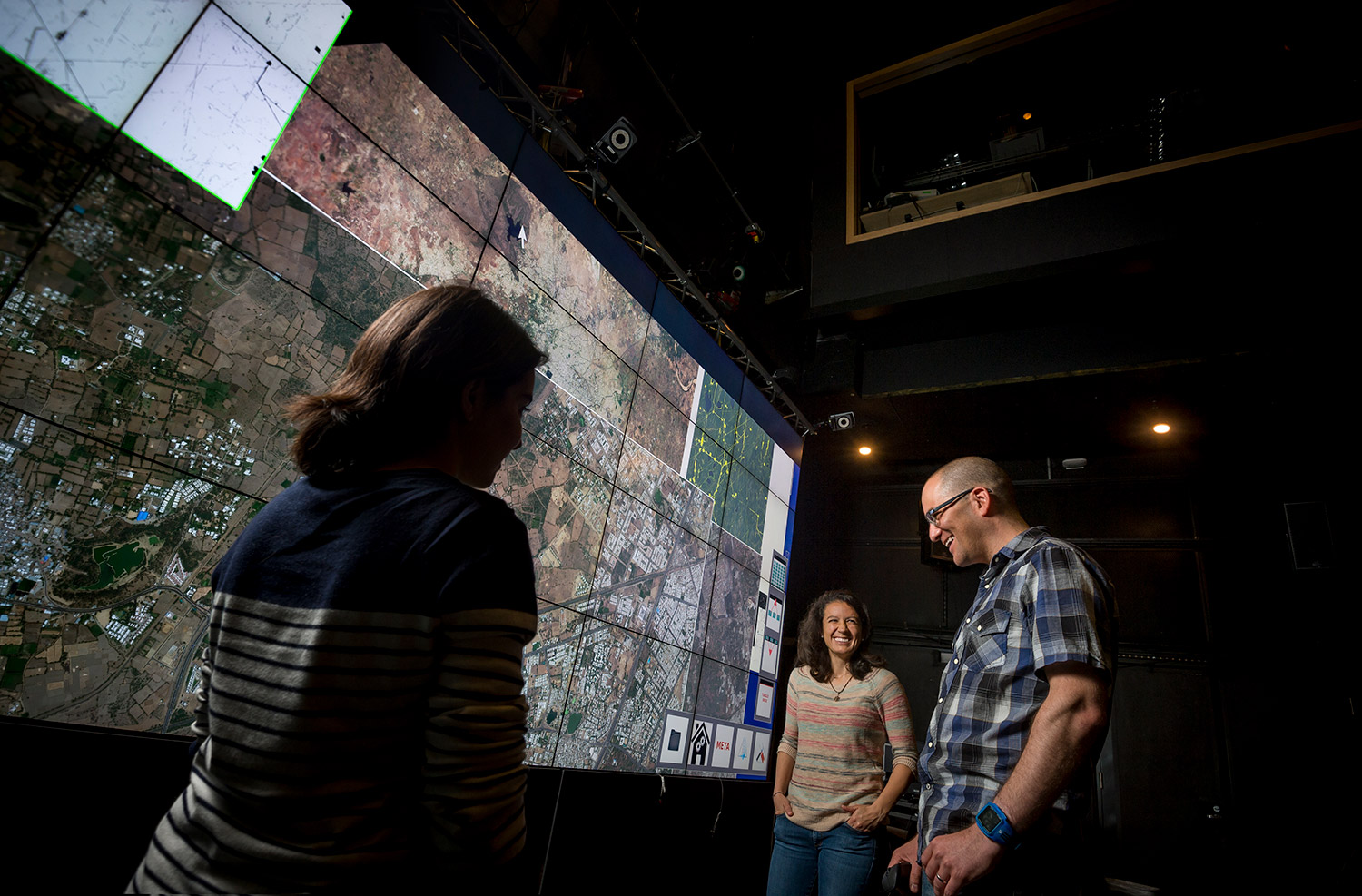 From left, Big Pixel Initiative research assistants Karla Yee-Amezaga and Stephanie Vallarino study high-resolution satellite images with Ran Goldblatt. Photo by Erik Jepsen/UC San Diego Publications.