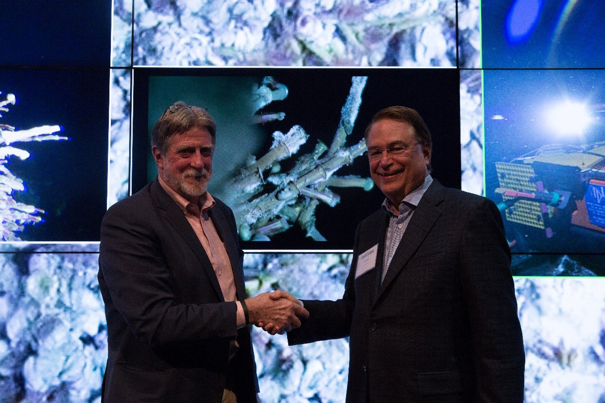 John Delaney and Larry Smarr celebrate the achievement of delivery of remote-controlled live HD vide