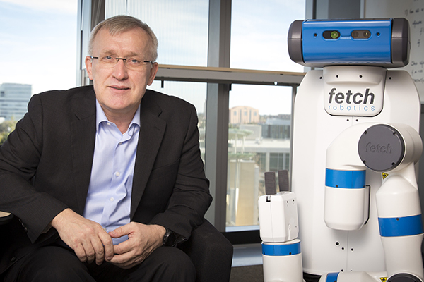 Contextual Robotics Institute Director Henrik Christensen with industry robot