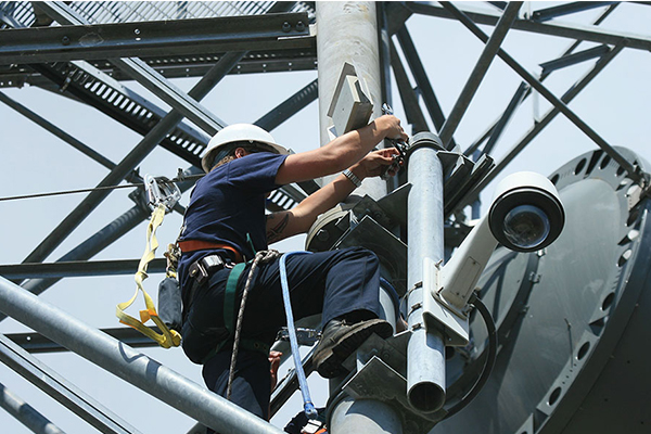 Antenna installation on a microwave tower to connect a nearby fire station to HPWREN. Courtesy of HP