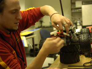 The corporate partner approached Kimball with the idea for the project after seeing the Circuit Lab's Gizmo devices (shown here with Programmar Analyst Javier Rodriqguez Molina). Gizmos are technologically sophisticated mobile communications “rovers” that can collect and transmit data in real time. 