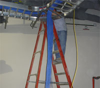 Installing cable from ladder