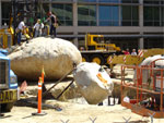 Men on torso boulder